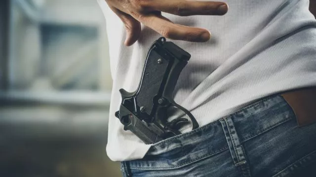 _100204304_manwithgun