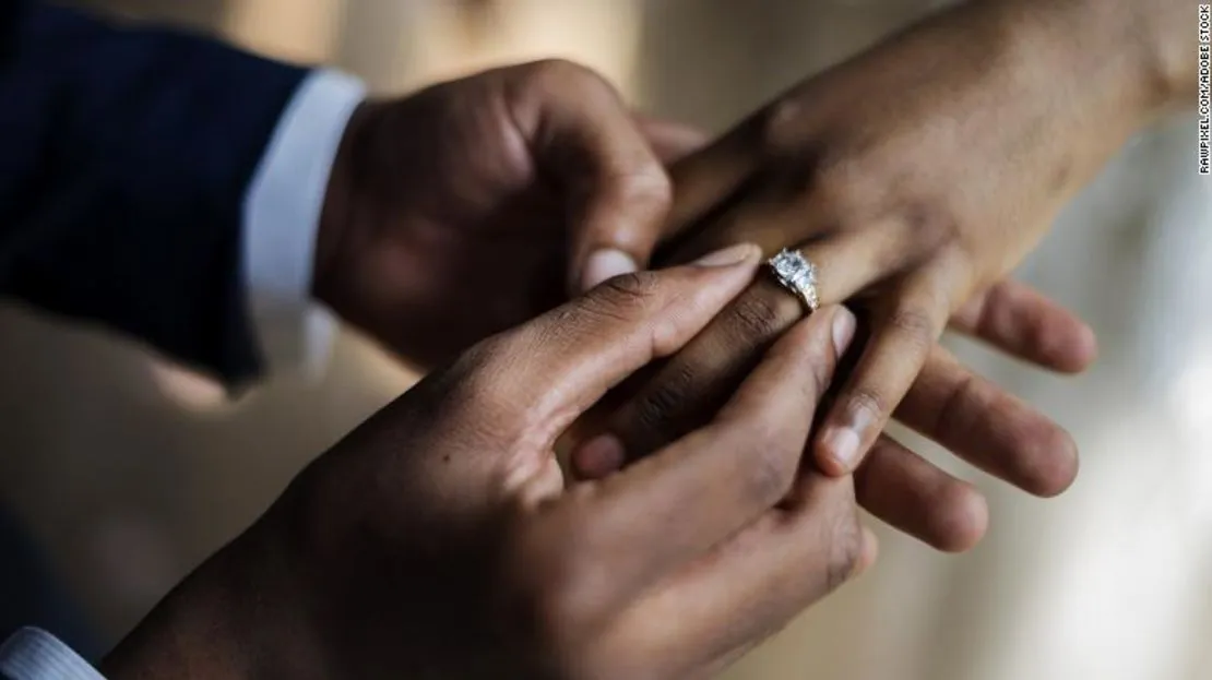 cnne-1153684-groom-put-on-wedding-ring-bride-hand